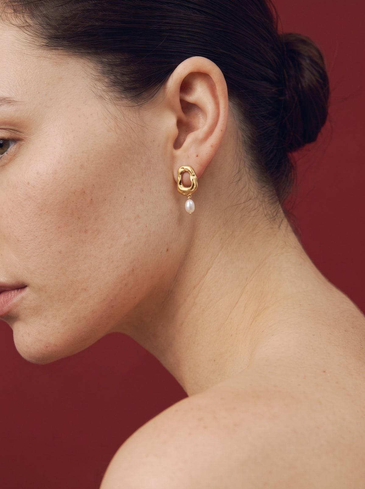 Model wearing an Apreels earring